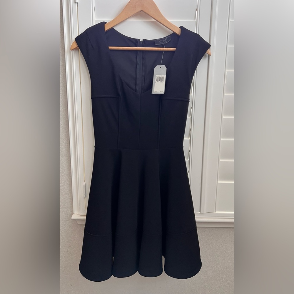 Guess little black dress. Size small. Never worn & tags attached.